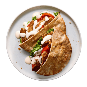 Trendi otthoni döner húslap egy kerek tányéron elkészítve, tálalva